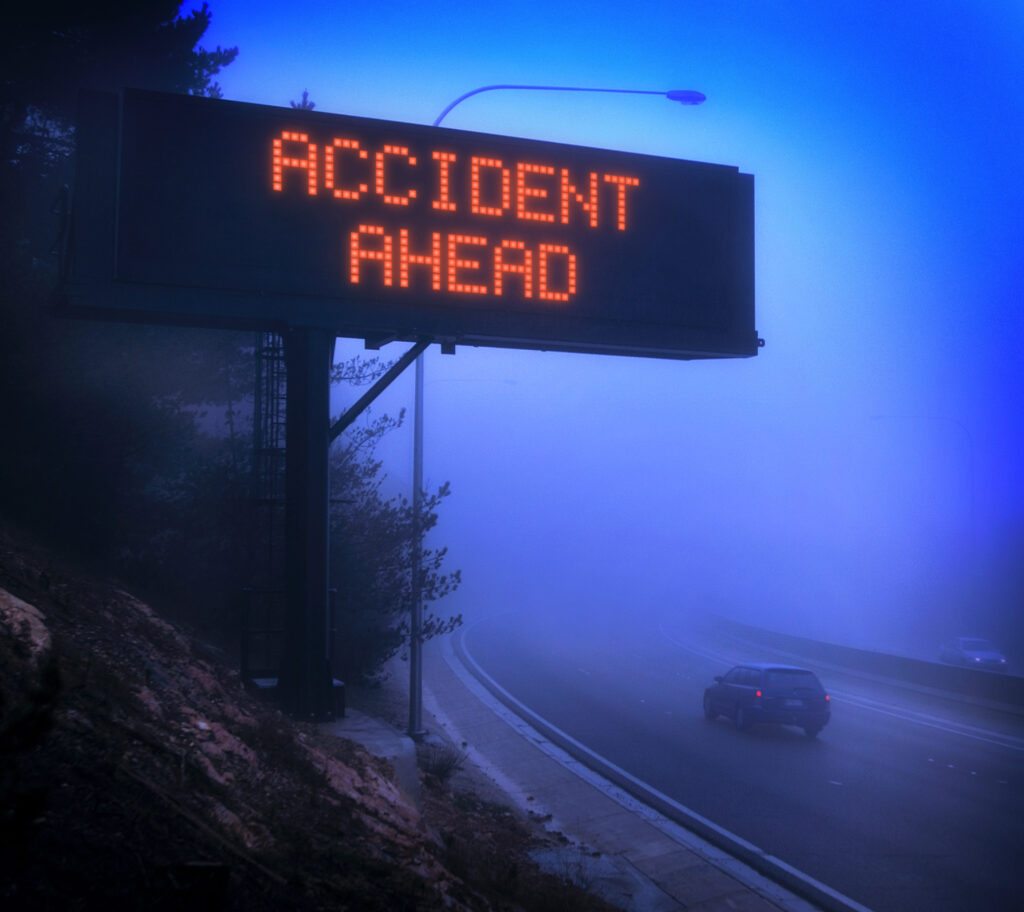 Common Tractor Trailer Accident Injuries - road advisory sign fog